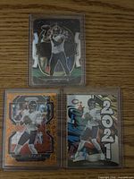 All three Justin Fields rookie cards in holders
