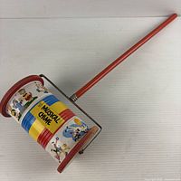 Full view of Fisher-Price Musical Chime push toy showing handle, drum cylinder and frame