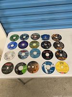 Full group shot of 20 loose CD-ROM discs on table