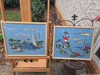 Both framed embroidered artworks displayed outdoors