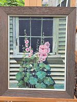 Framed oil painting showing entire composition of hollyhocks and window