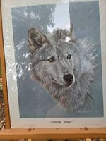 Full view of framed print showing wolf image, mat, and frame