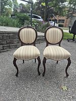 Front view of both rococo revival side chairs