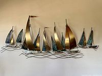 Full view of metal sailboat wall sculpture showing overall design and width