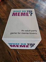 Front of What Do You Meme? game box