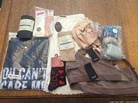 All nine apparel items laid out on table