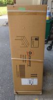 Factory-sealed Outsunny planter box carton front with brand logo and line drawing of assembled flower bed.