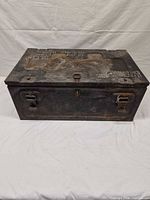Closed trunk front view showing latches and hasp