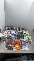 All 15 Batman-related comics laid out on backdrop