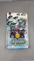 Front view of sealed Alpha Flight two-pack showing figures and card