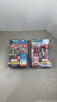 Both sealed Marvel Legends figures side by side
