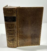 Spine and front board showing gilt tooling, black label, tree-calf leather
