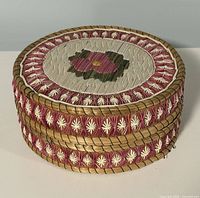 Overall view of closed basket showing floral motif and quill patterns
