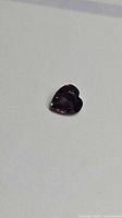 Heart-shaped purple sapphire front view