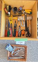 Drawer view of all tools including Black & Decker screwdriver, hammer, mallet, staple gun, files, pliers, level, combination wrenches in basket