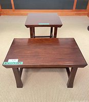 Top view of both tables showing size relationship and finish