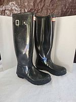 Both boots side view showing side buckle and logo