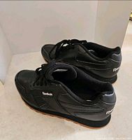 Both shoes angled rear and side showing condition and logos