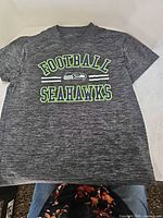 Front view of Seattle Seahawks kids T-shirt showing graphic and overall condition