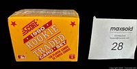 Front of sealed yellow Score 1990 Rookie & Traded card box with MLB logo and 110 player card text visible