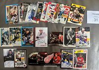 All 25 autographed hockey cards laid out
