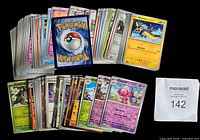 Stack and spread of the Pokémon cards showing quantity and card backs