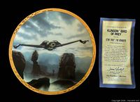 Front of Klingon Bird-of-Prey plate alongside Certificate of Authenticity