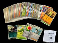 Fan spread of entire lot showing stack of cards and several highlighted fronts