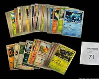 Stacked and fanned out view of the 59 Pokémon Surging Sparks cards