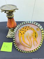Plaque front and candlestick side by side