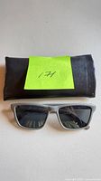 Front view of sunglasses and pouch