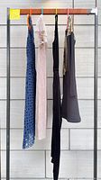 All four garments hanging on rack