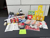 Overview of entire lot on table with assorted boxed and blister-packed bulbs