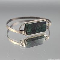 Front view showing malachite inlay and bracelet form