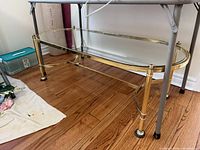Full view of oval coffee table under folding table