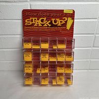 Full front view of acrylic display showing header and compartments