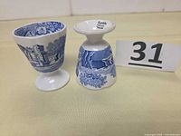 Two Spode Blue Italian egg cups, one inverted to show pedestal