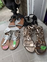 All four pairs of sandals laid out together
