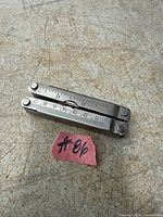 Multi-tool folded, top view showing dual rulers on handles
