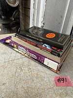 Stack of five books showing titles and spines