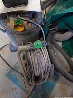 Extension cord reel beside other tools showing overall item