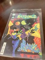 Front view of bagged Batgirls comic displaying cover art and DC logo