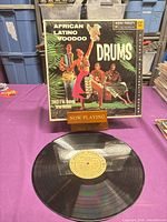 Record on table with sleeve behind