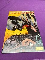 Front cover of The Walking Dead #128 comic showing full artwork and signature sticker