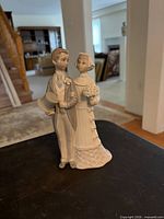 Front view of Lladró bride and groom figurine