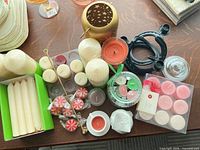 overview of all candles, holders and accessories on table