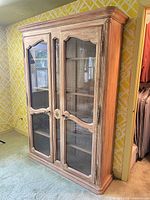 Angled view of entire pickled ash display cabinet