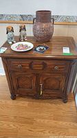 Front view of French Provincial oak cabinet with drawer and two doors