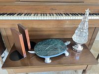 All items together on piano bench: tray, tree, bookends