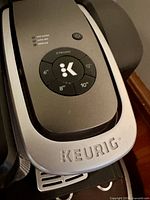 Top control panel of Keurig brewer showing K-Select layout and Strong Brew button